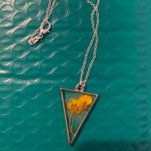 Silver and yellow necklace with pressed flower